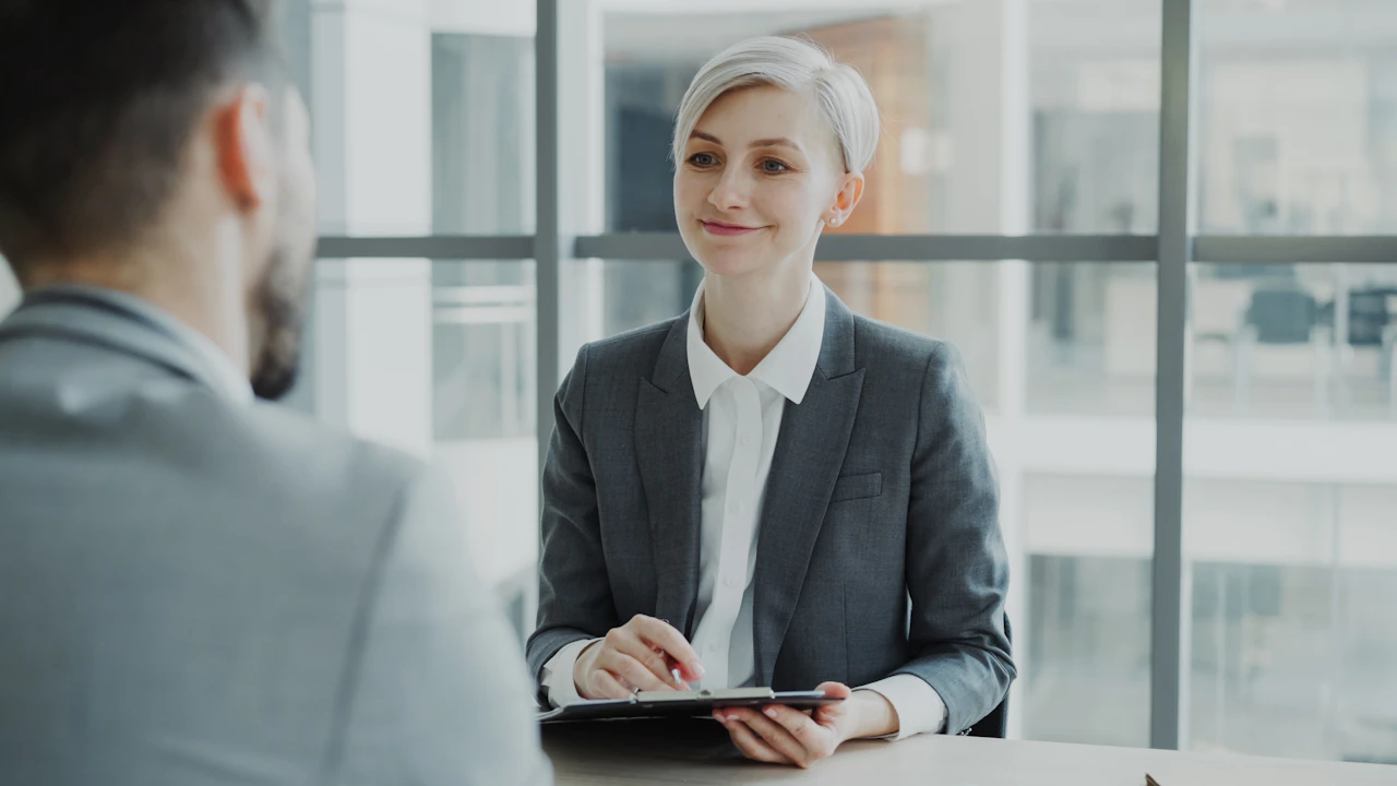 HR interviewer reviewing a candidate across the table