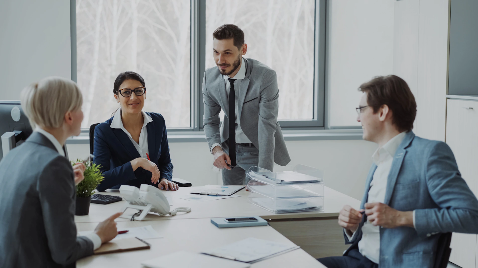 Business professionals collaborating around a conference table.