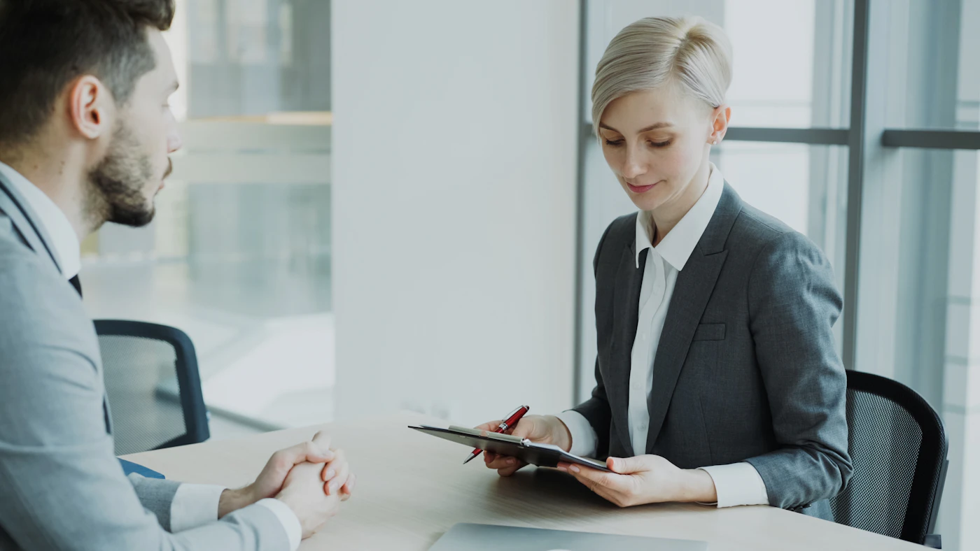 Candidate and reviewer examining a resume together