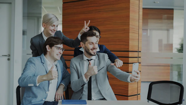Colleagues taking a selfie in the office