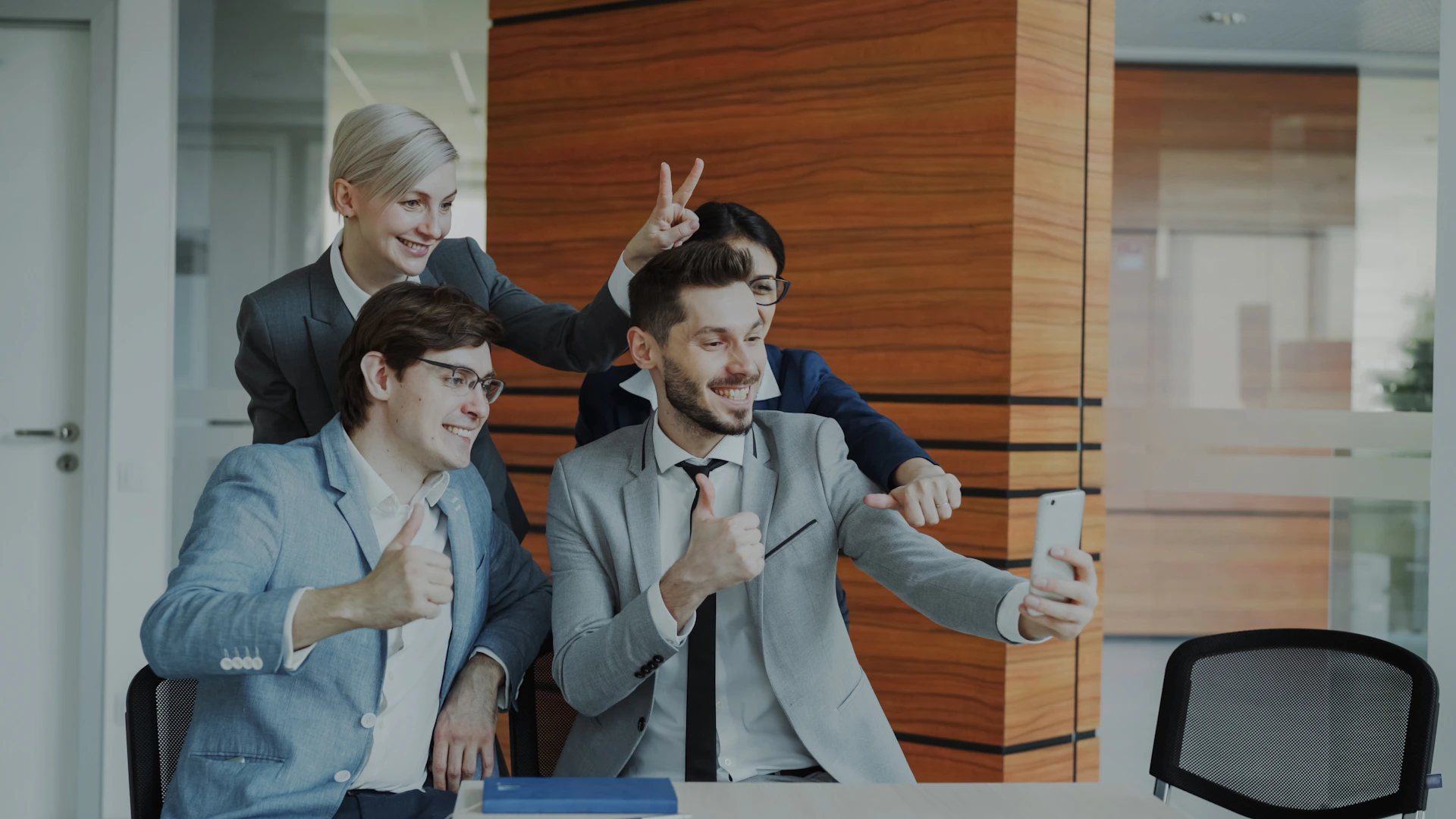 Colleagues taking a selfie in the office