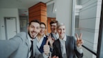 Group of happy business people taking a selfie