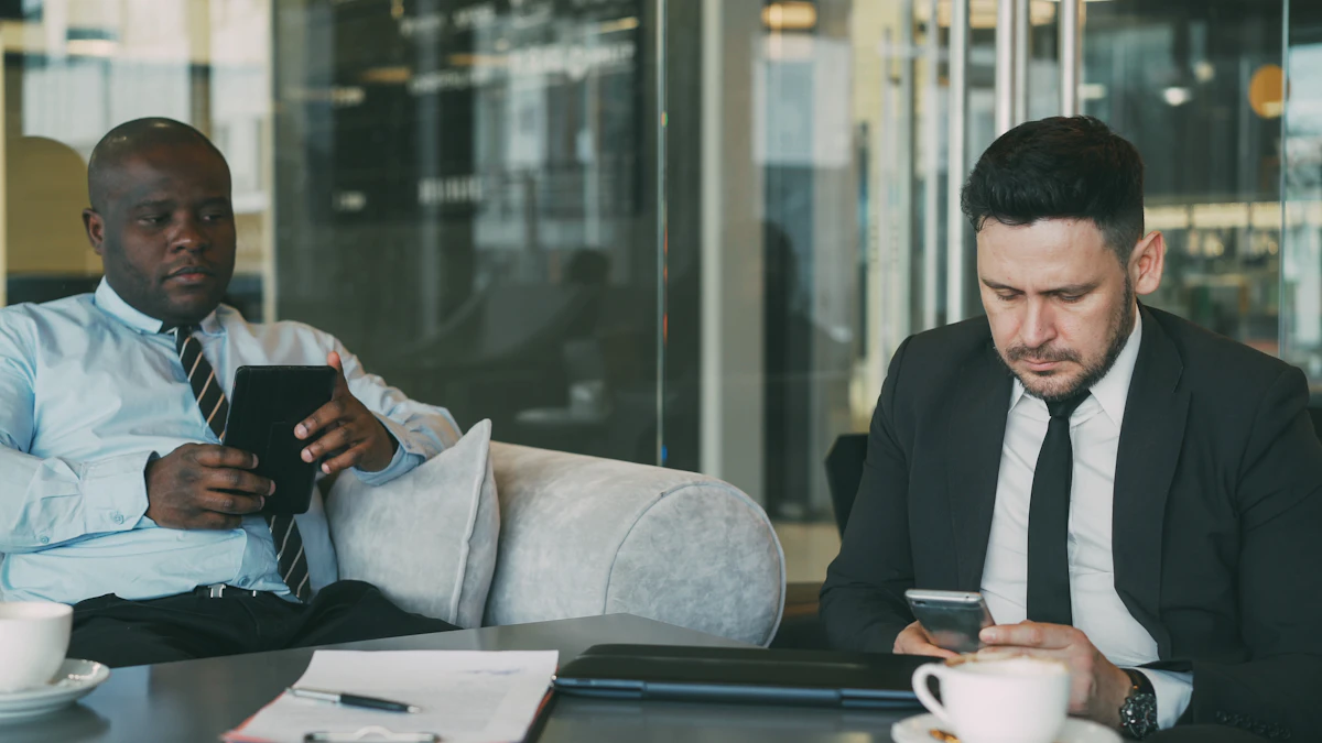 Two businessmen using devices in a modern office