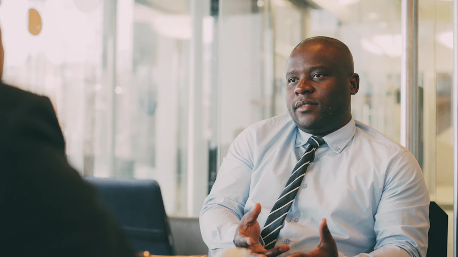 A mentor guiding a young entrepreneur