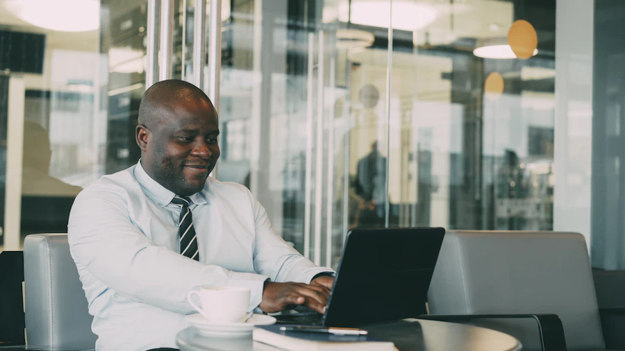 An African professional working on his laptop