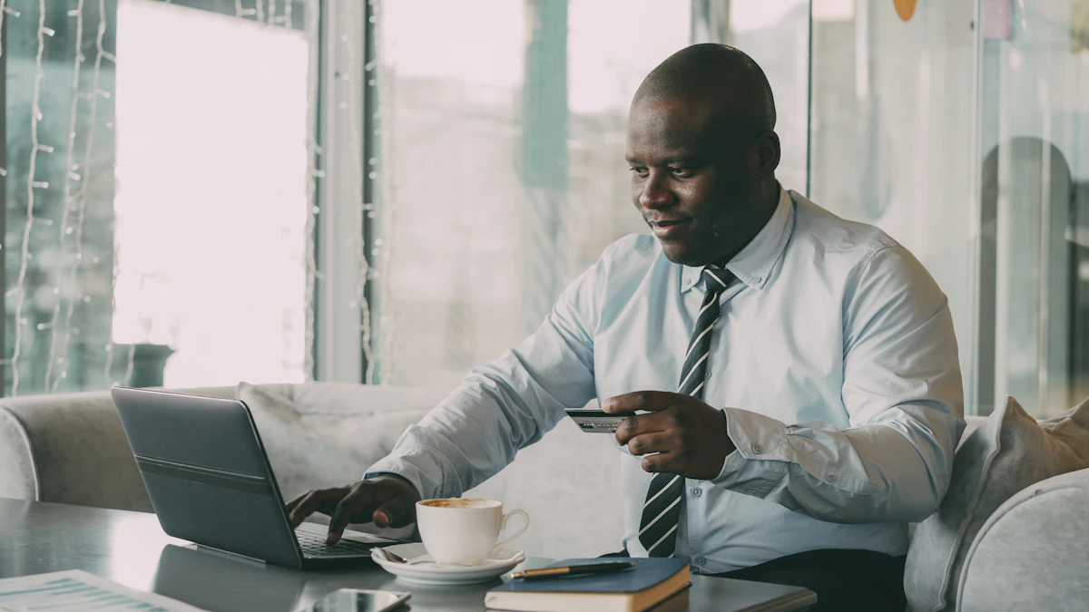 Man in shirt and tie using laptop and credit card