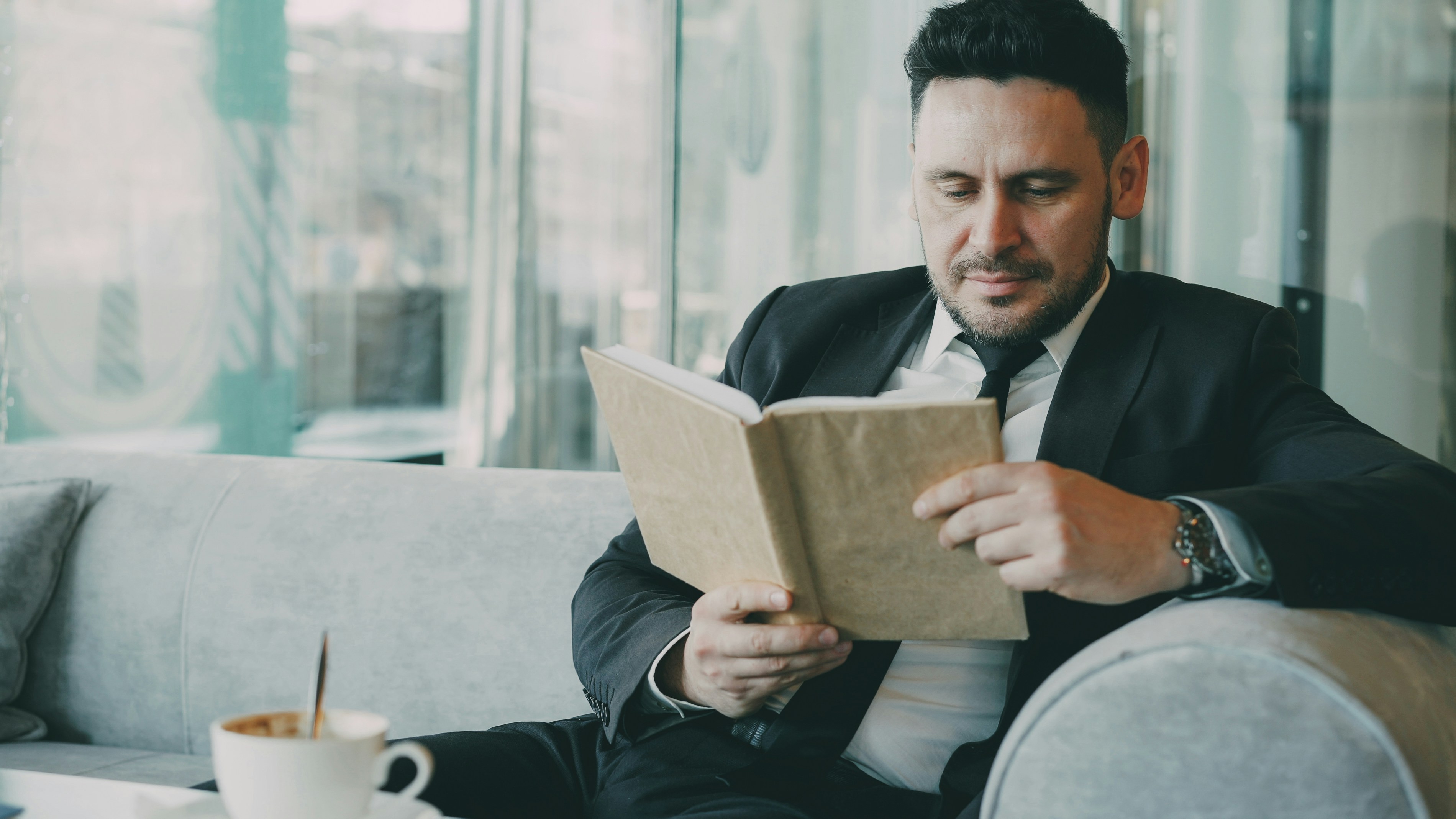 Businessman reading in cafe