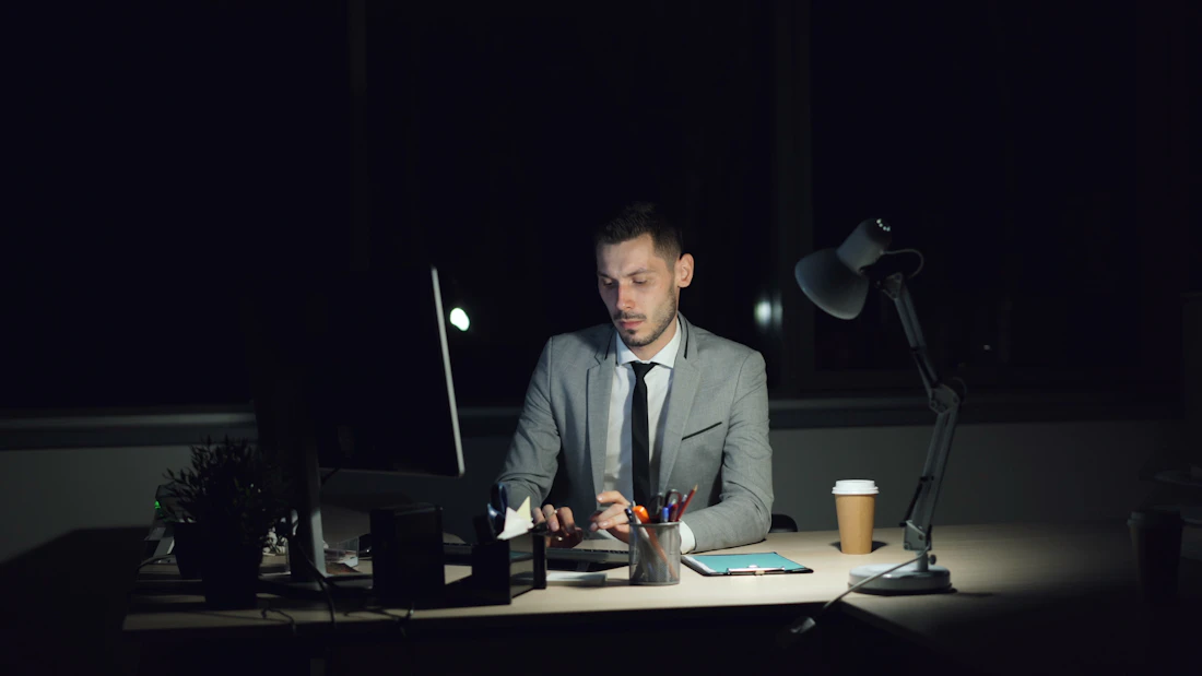 A man working late at his desk