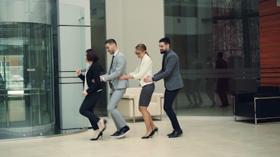 Business people in a line walking into building