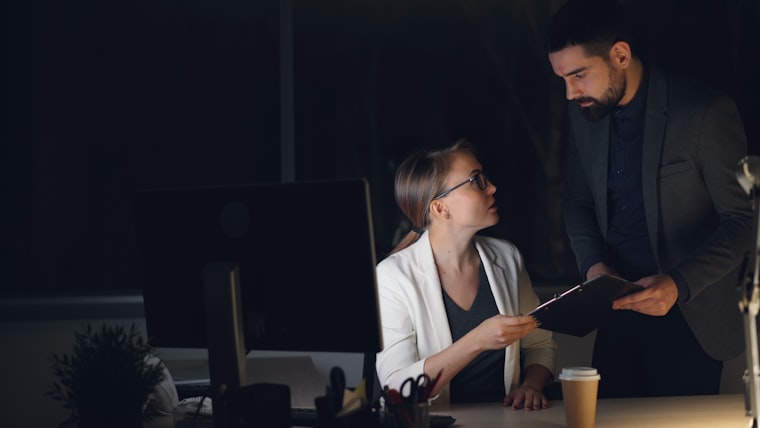 A property manager still at her desk after hours, working from memory.