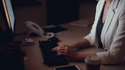 Woman working late at her office desk.