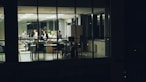 People working late in a modern office at night