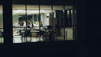People working late in a modern office at night