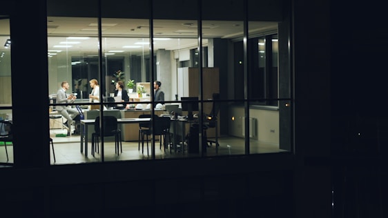 People working late in a modern office at night