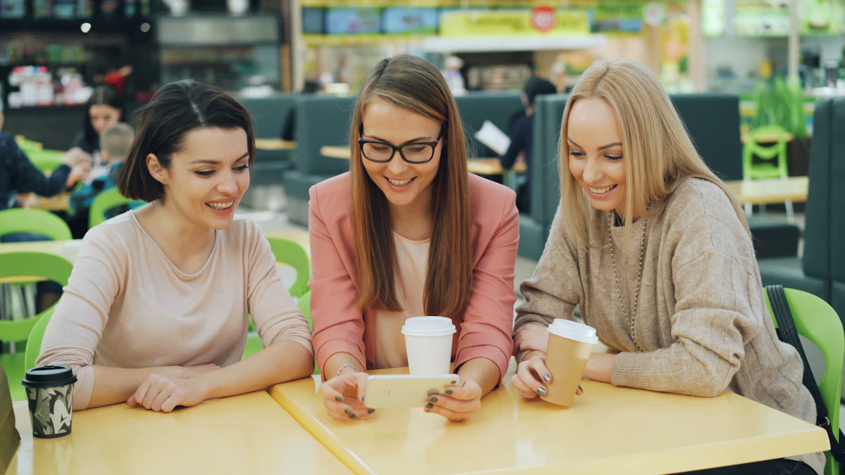 Three friends smiling at a phone together