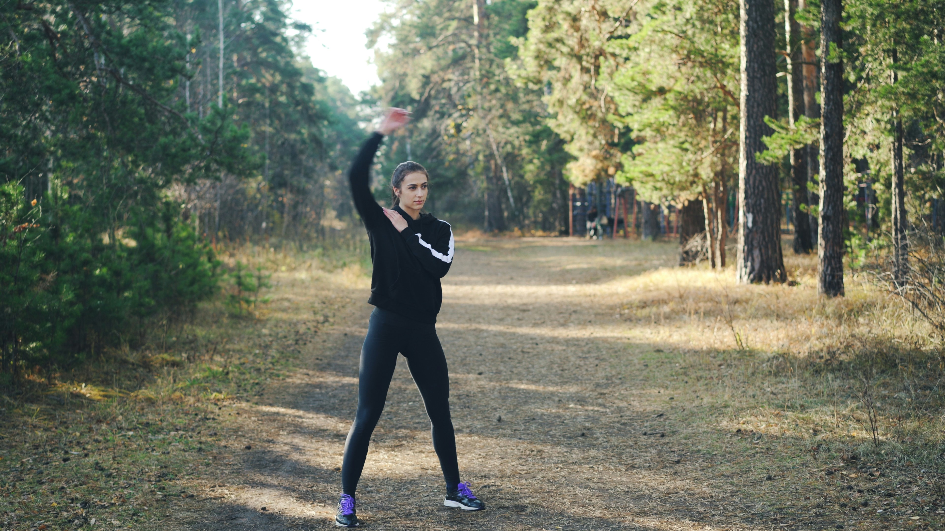 Woman stretching in natural setting