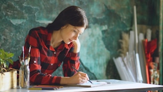 Young woman drawing in a studio