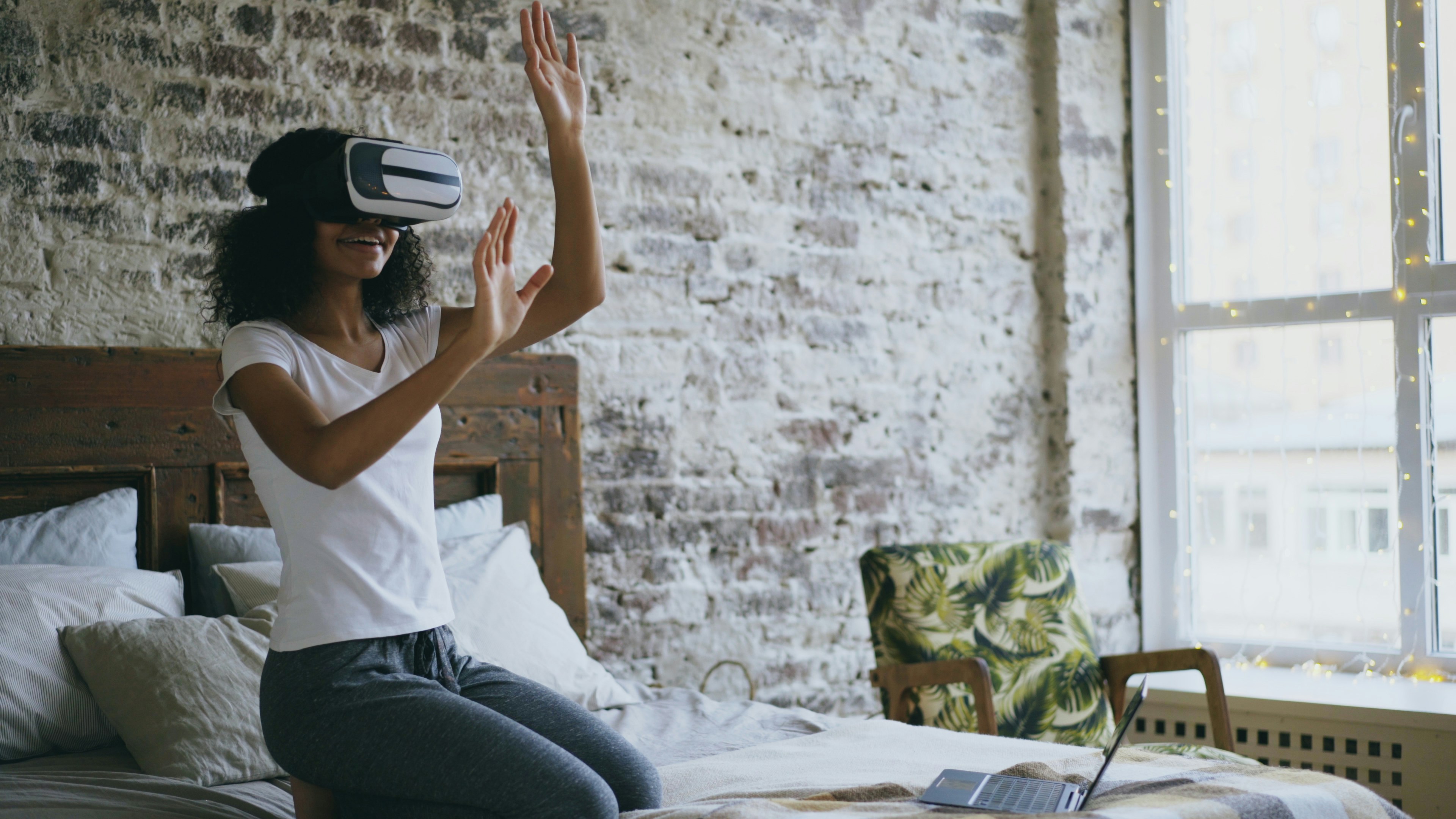 Woman interacting with virtual reality headset