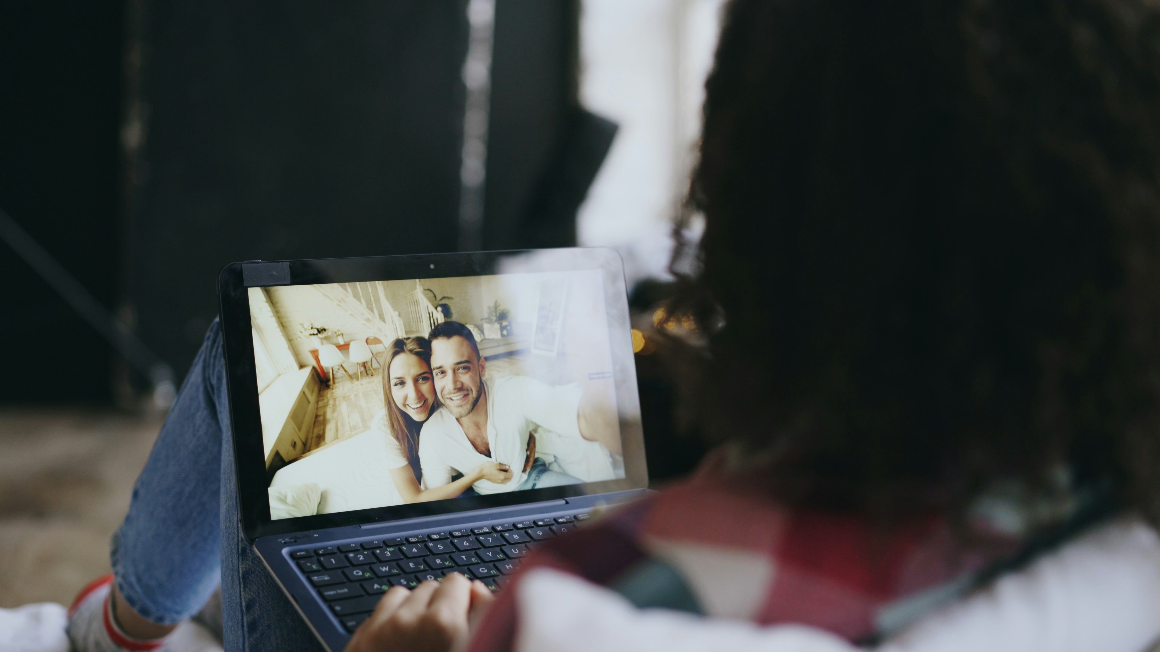 Young woman having video chat on laptop