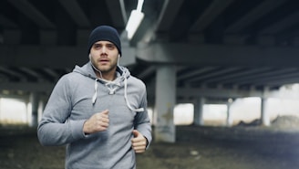 Man jogging under a concrete overpass