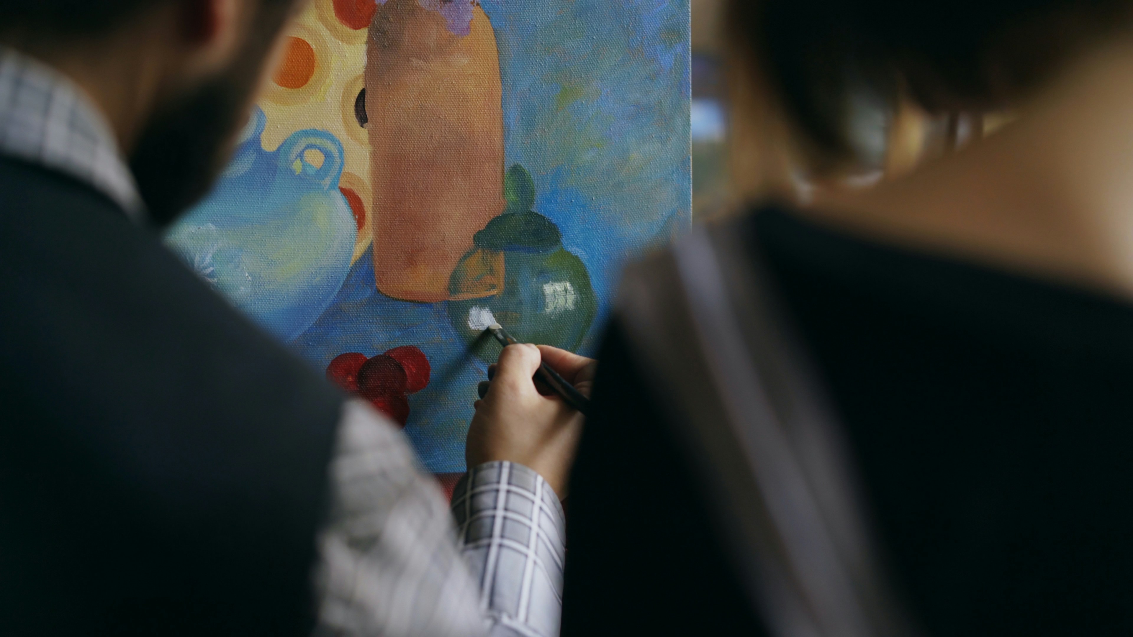 Art classroom with brushes, paints, and unfinished student work — symbolizing the revival of creative subjects in UK schools.