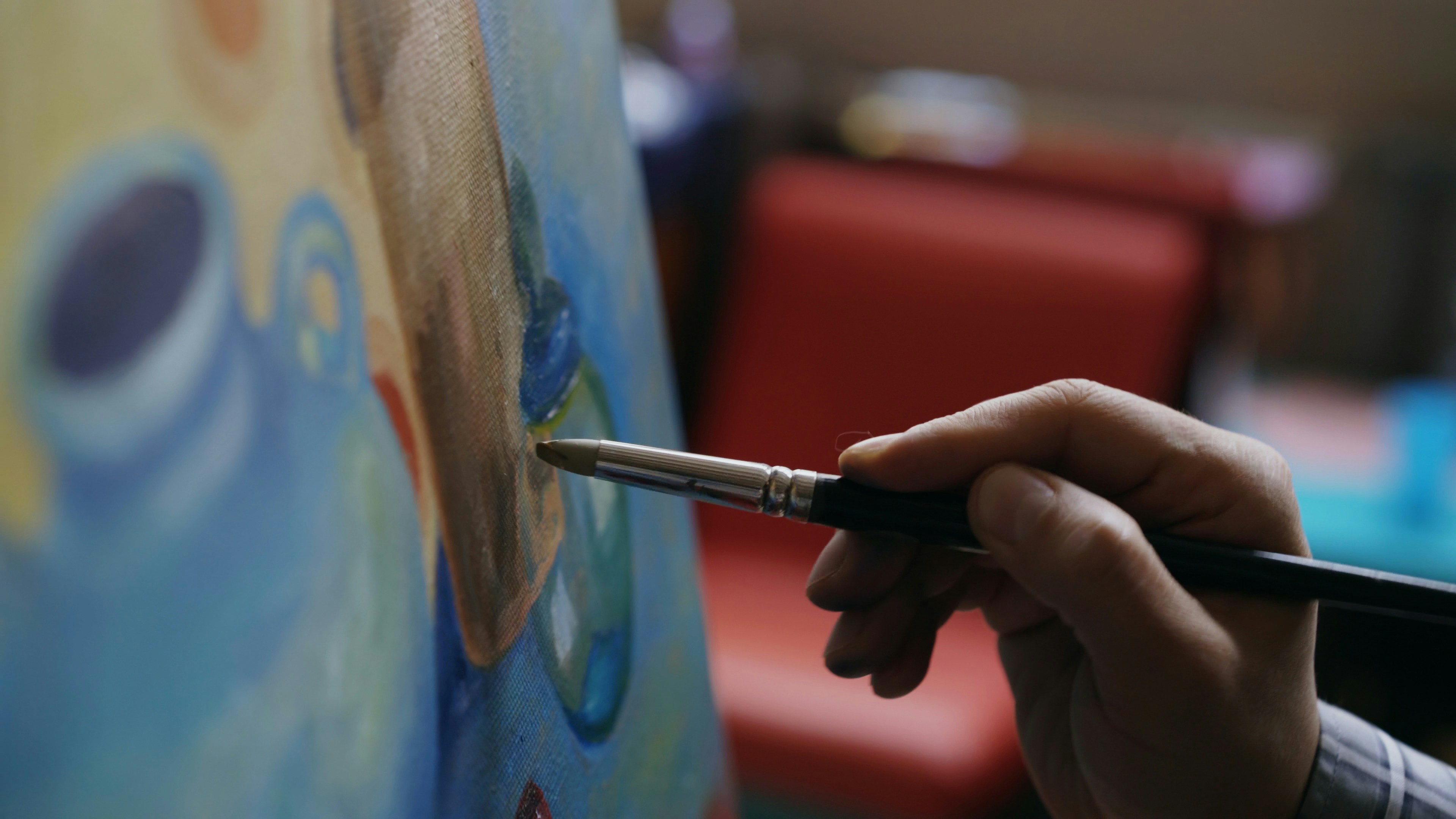 A person painting with passion.