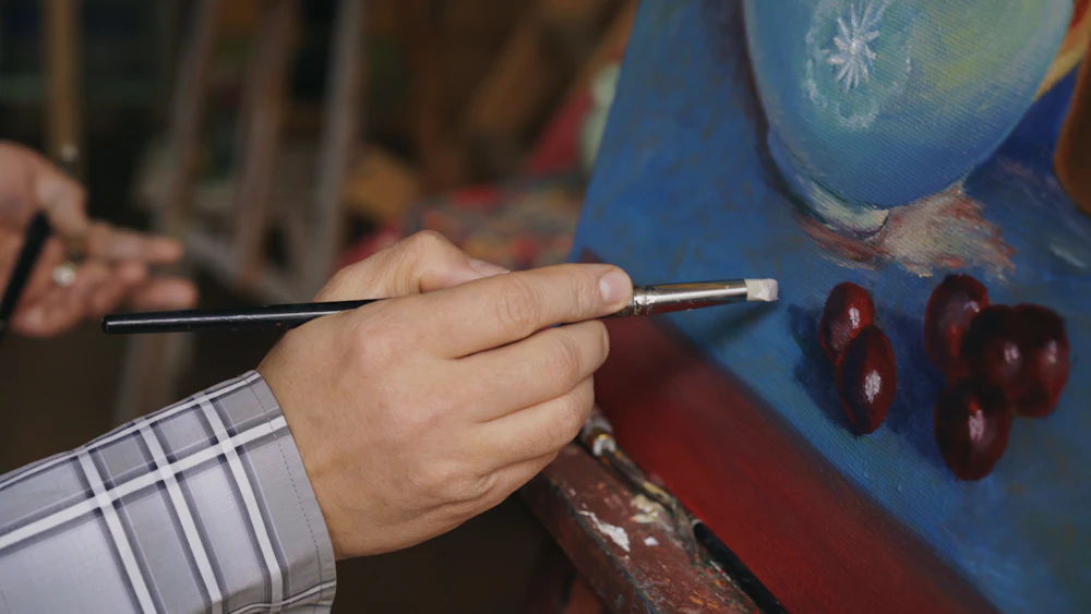 Artista pintando un bodegón (imagen provisional)