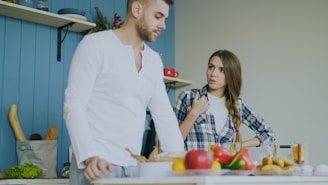 Couple arguing in a kitchen
