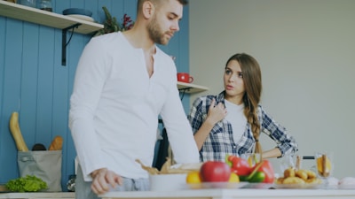 Couple arguing in a kitchen