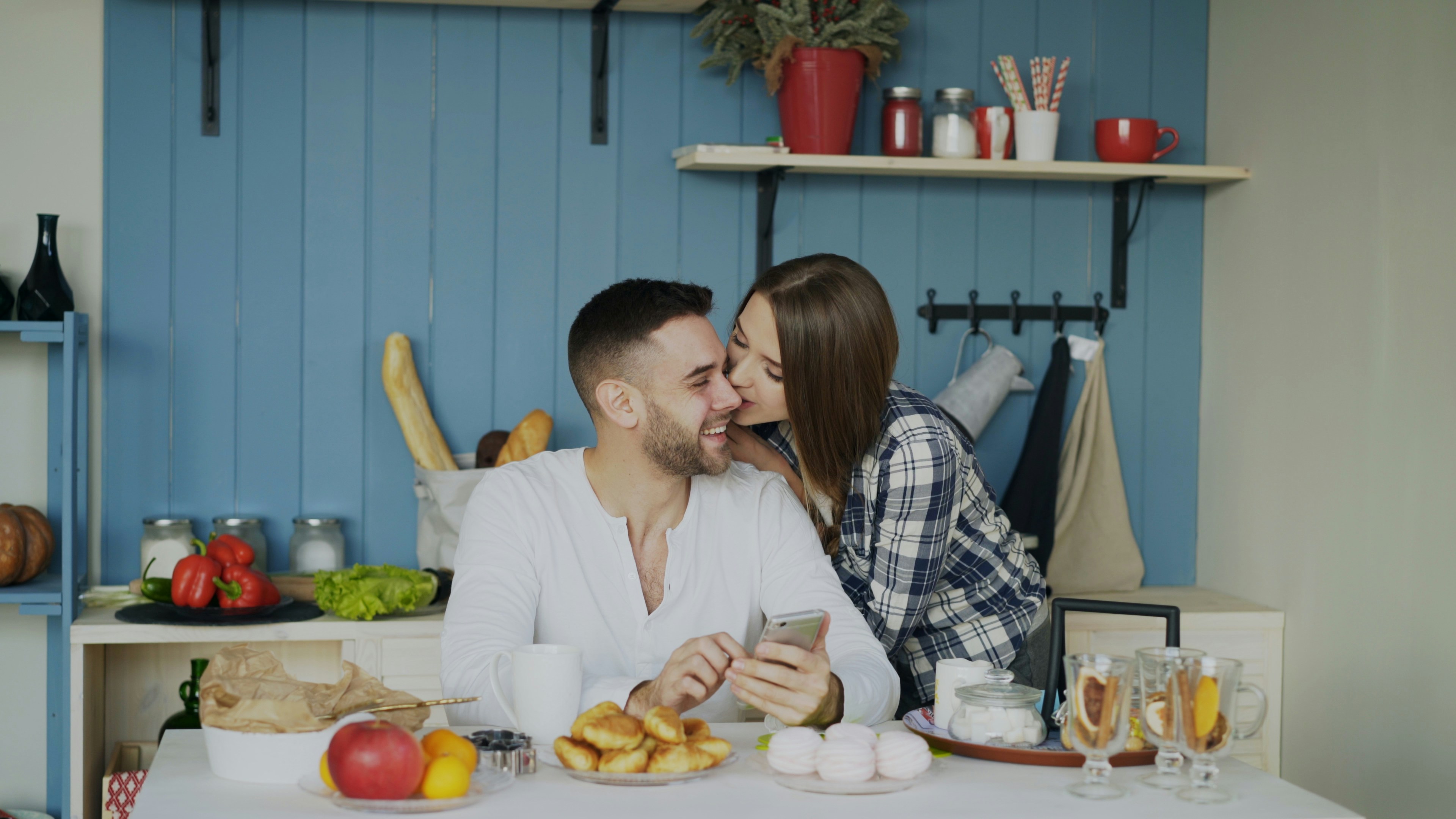 Attractive couple meet in the kitchen
