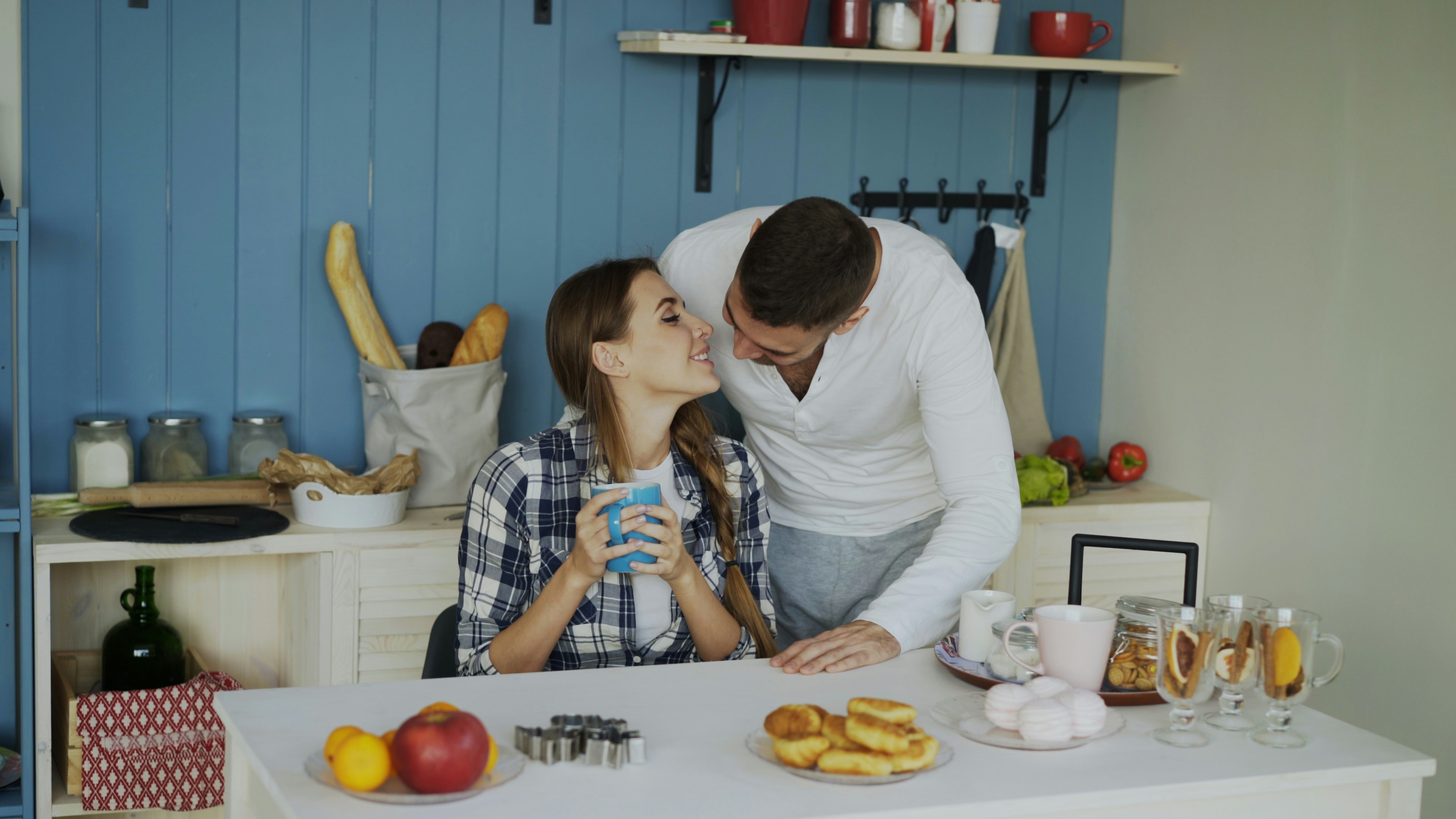 Couple sharing a tender moment in the kitchen