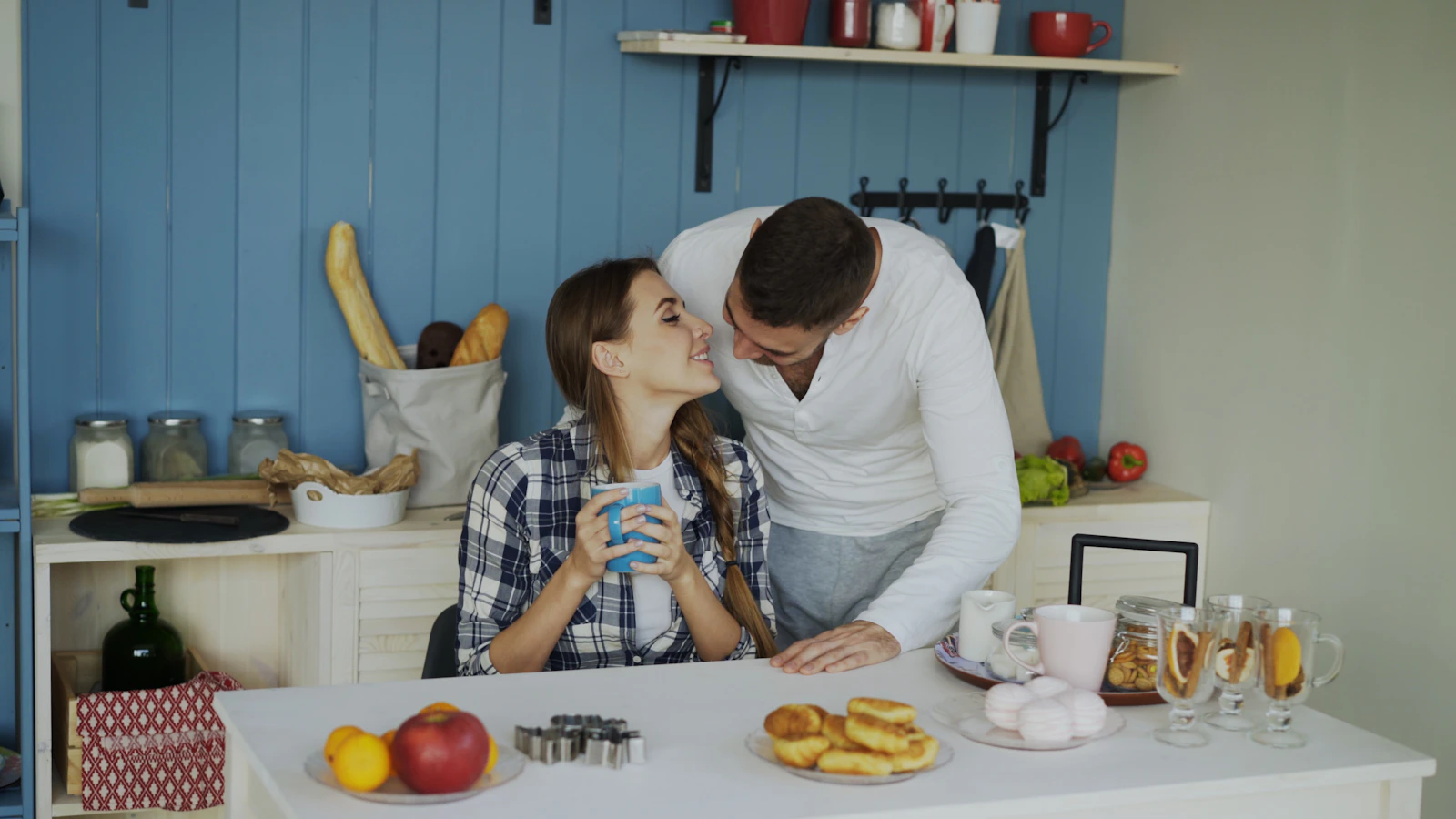 Couple sharing a tender moment in the kitchen