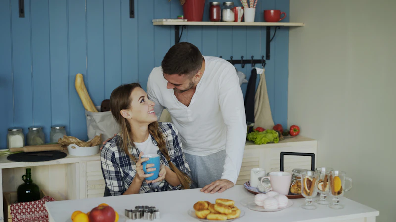 Couple sharing a morning conversation in a kitchen