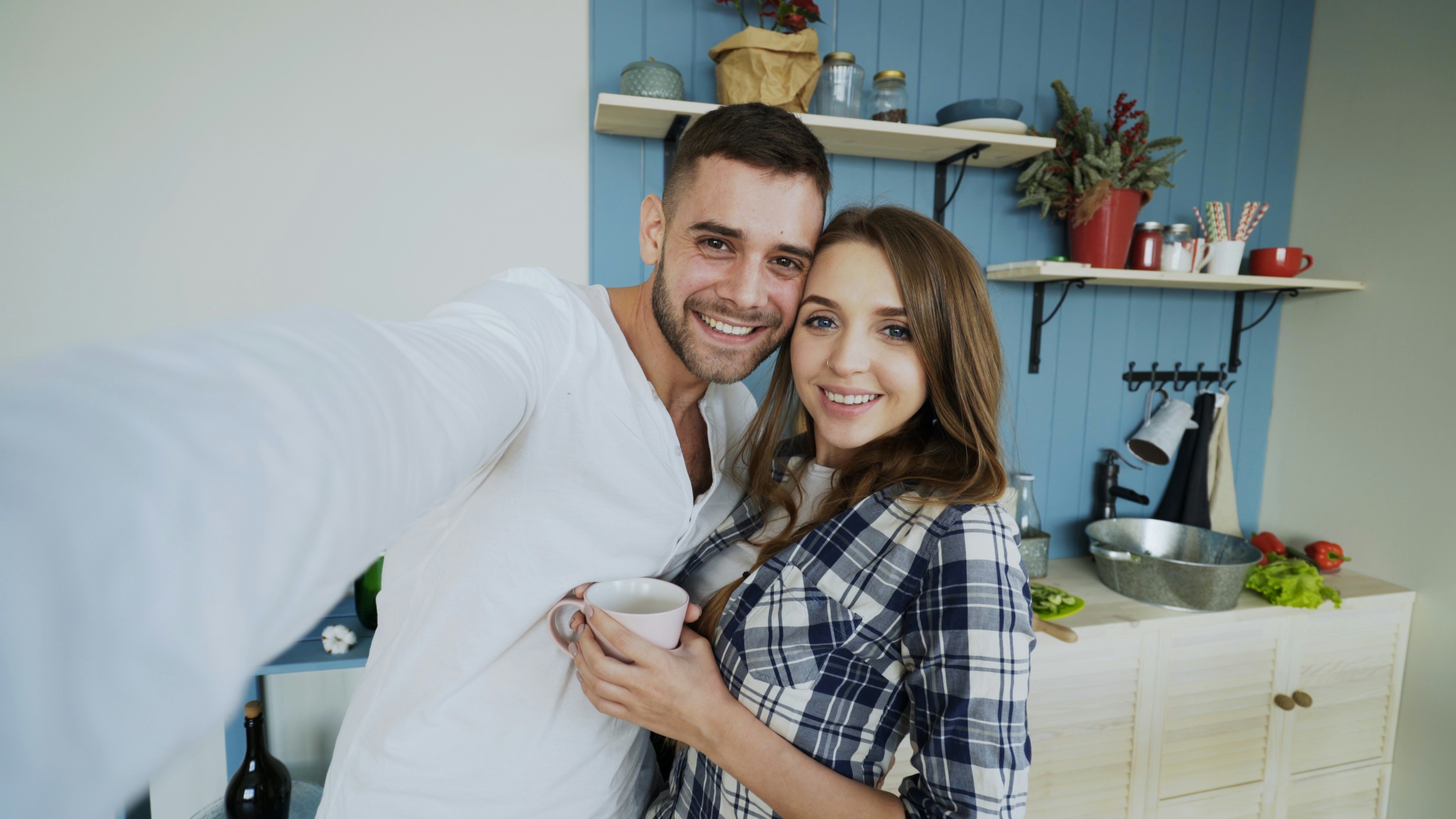Couple taking a selfie in the kitchen