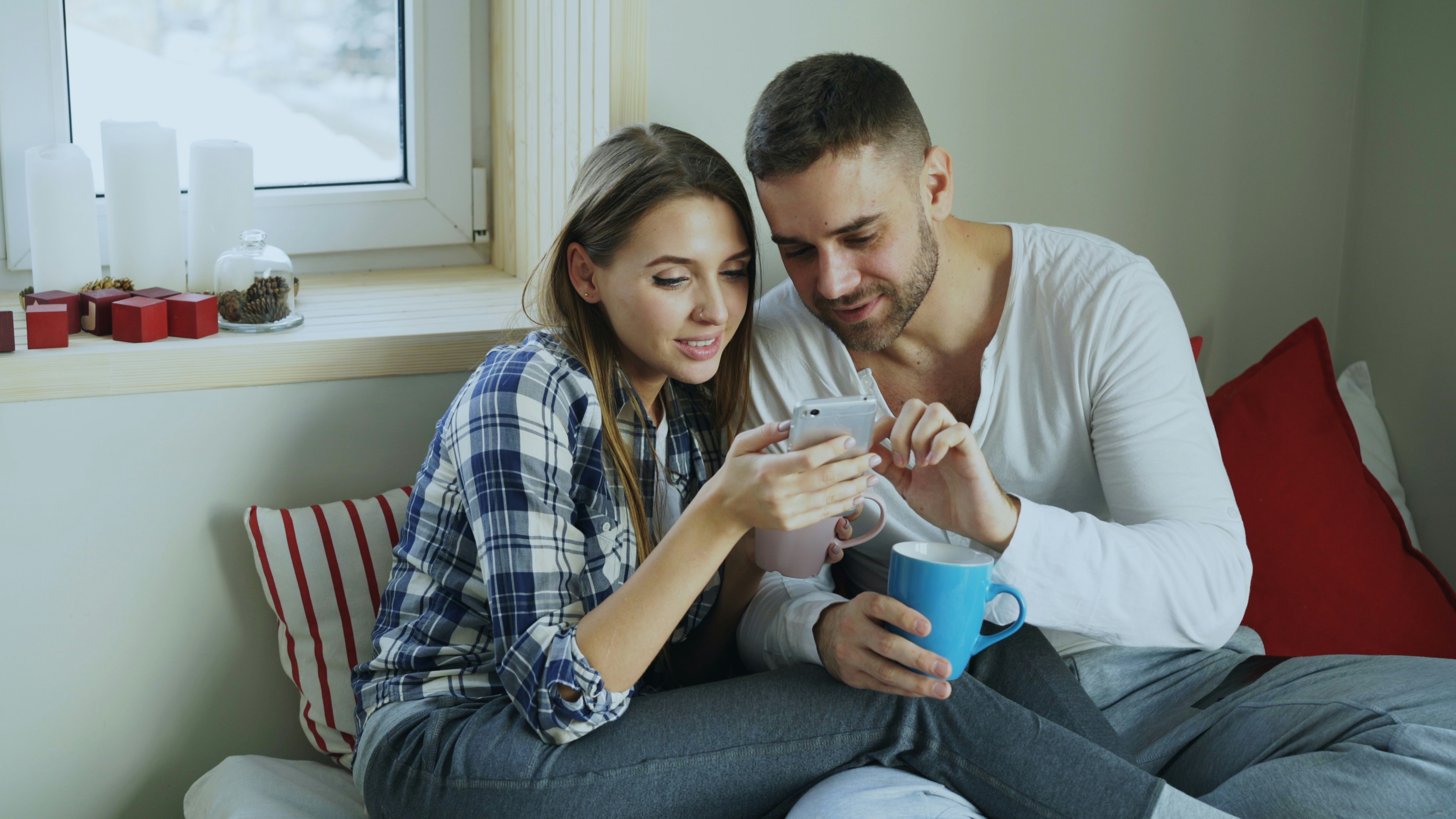 Couple looking at a smartphone together