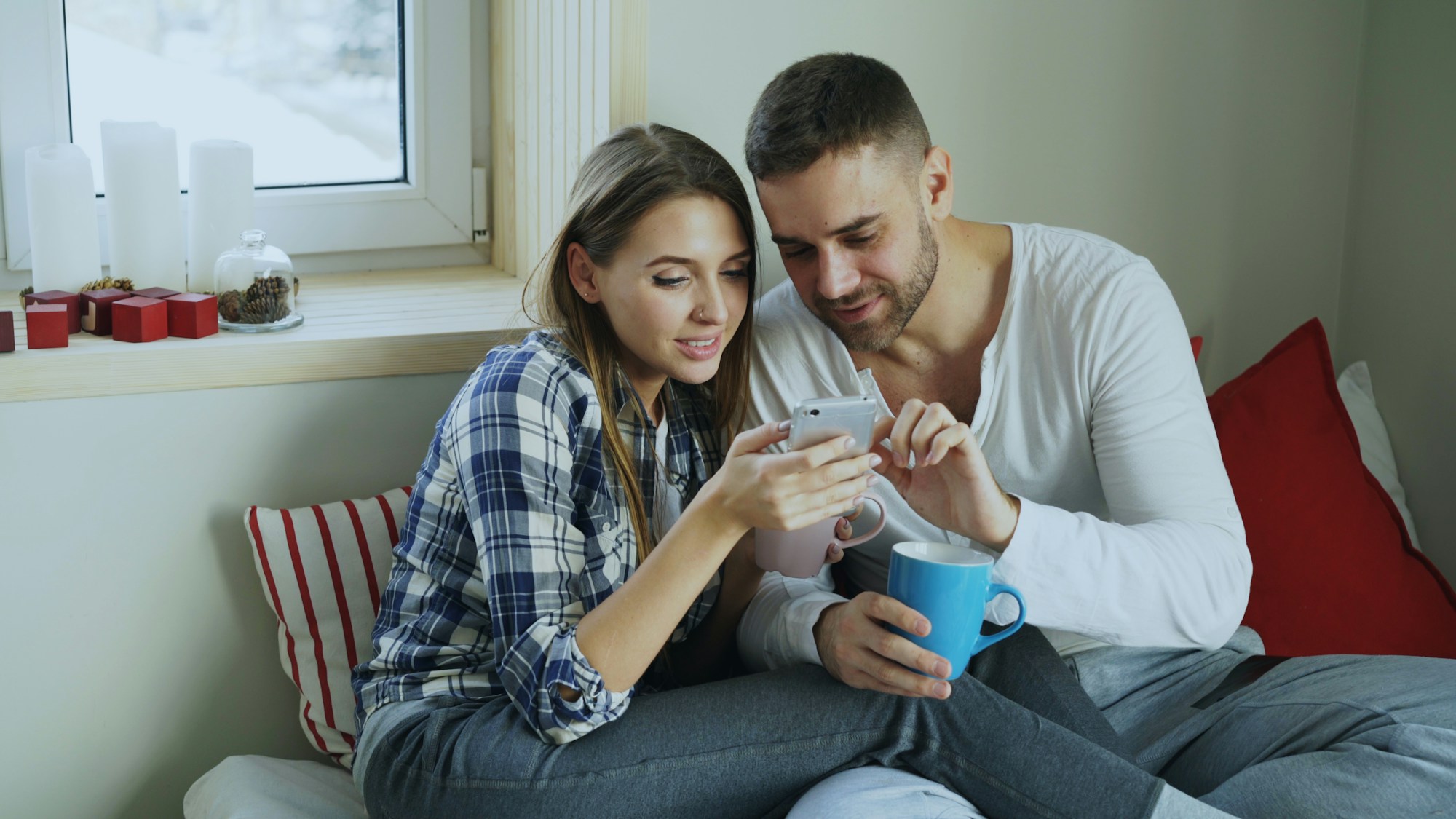 Young couple looking at a smartphone together
