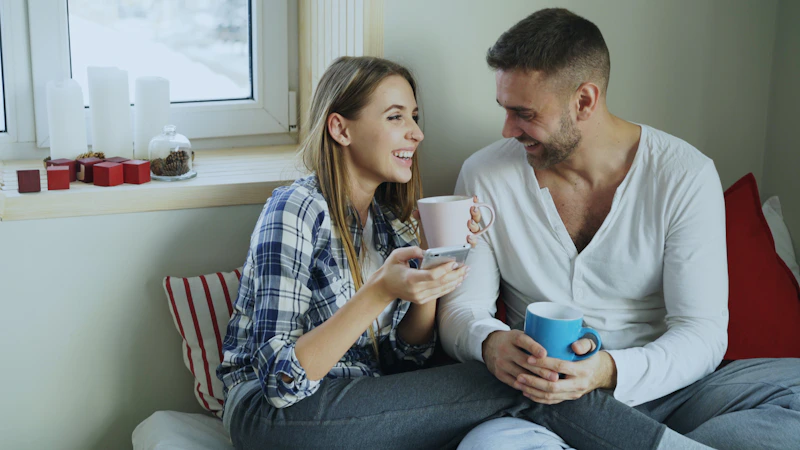 couple enjoying coffee by the window