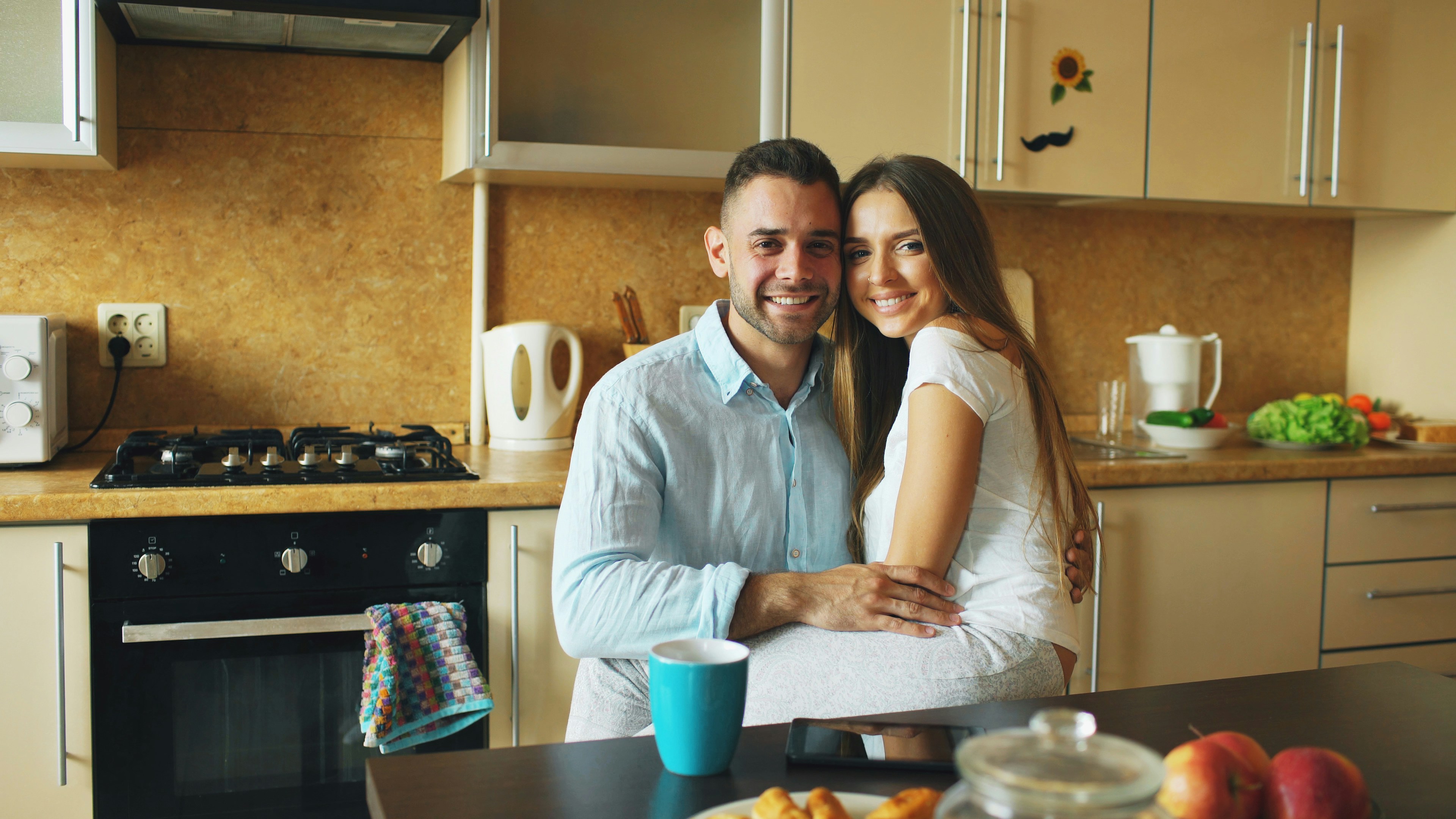 Couple happily touring a modern apartment with a leasing agent - Premium apartments for rent