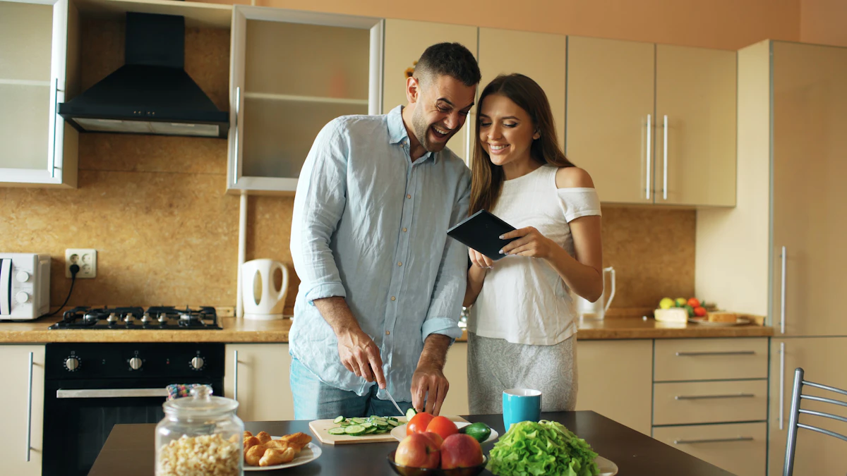 Young smiling couple preparing fresh ingredients and cooking together in kitchen