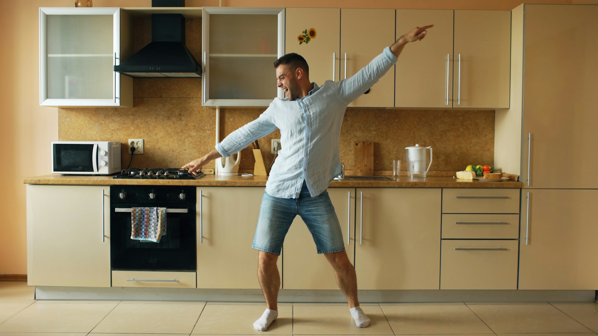 Man dancing in a modern kitchen