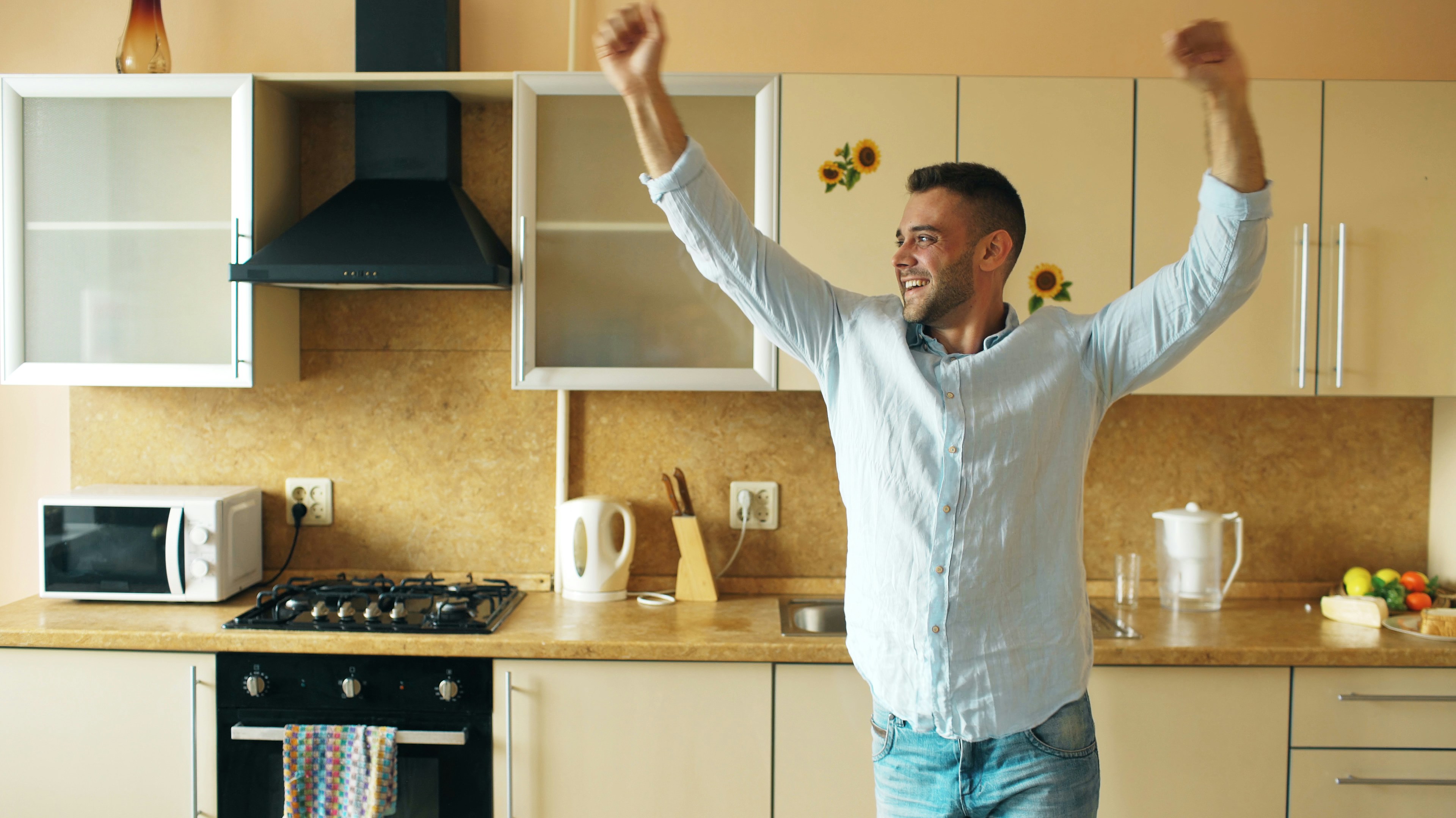 Man dancing in kitchen