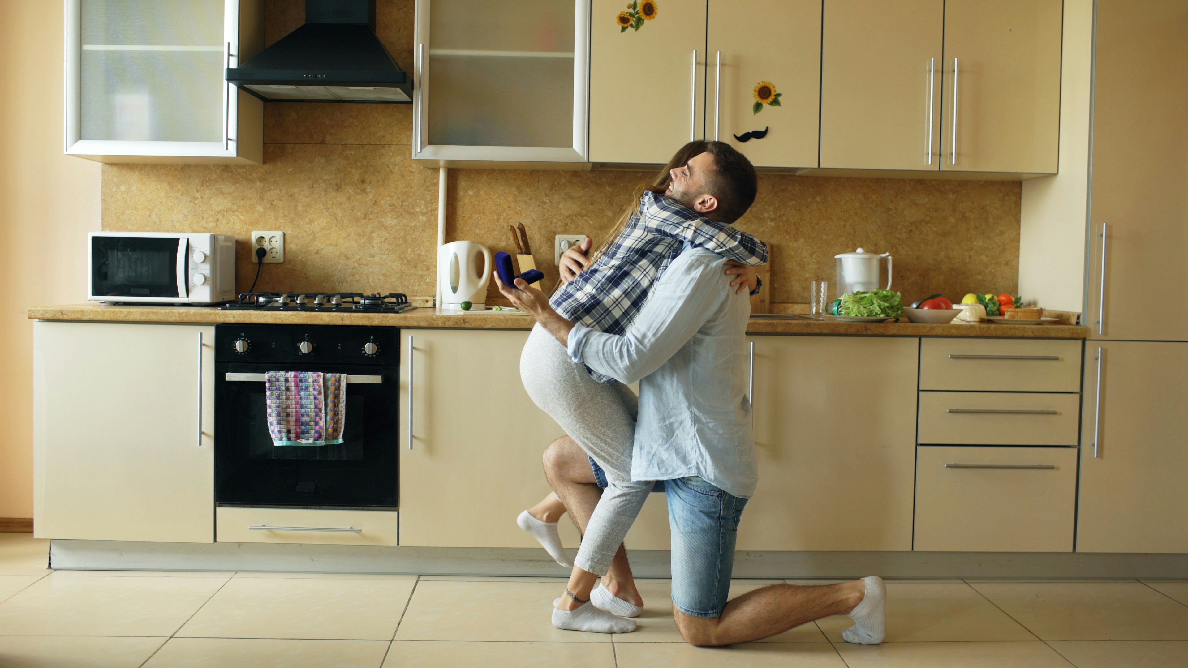 Young man making proposal to his girlfriend