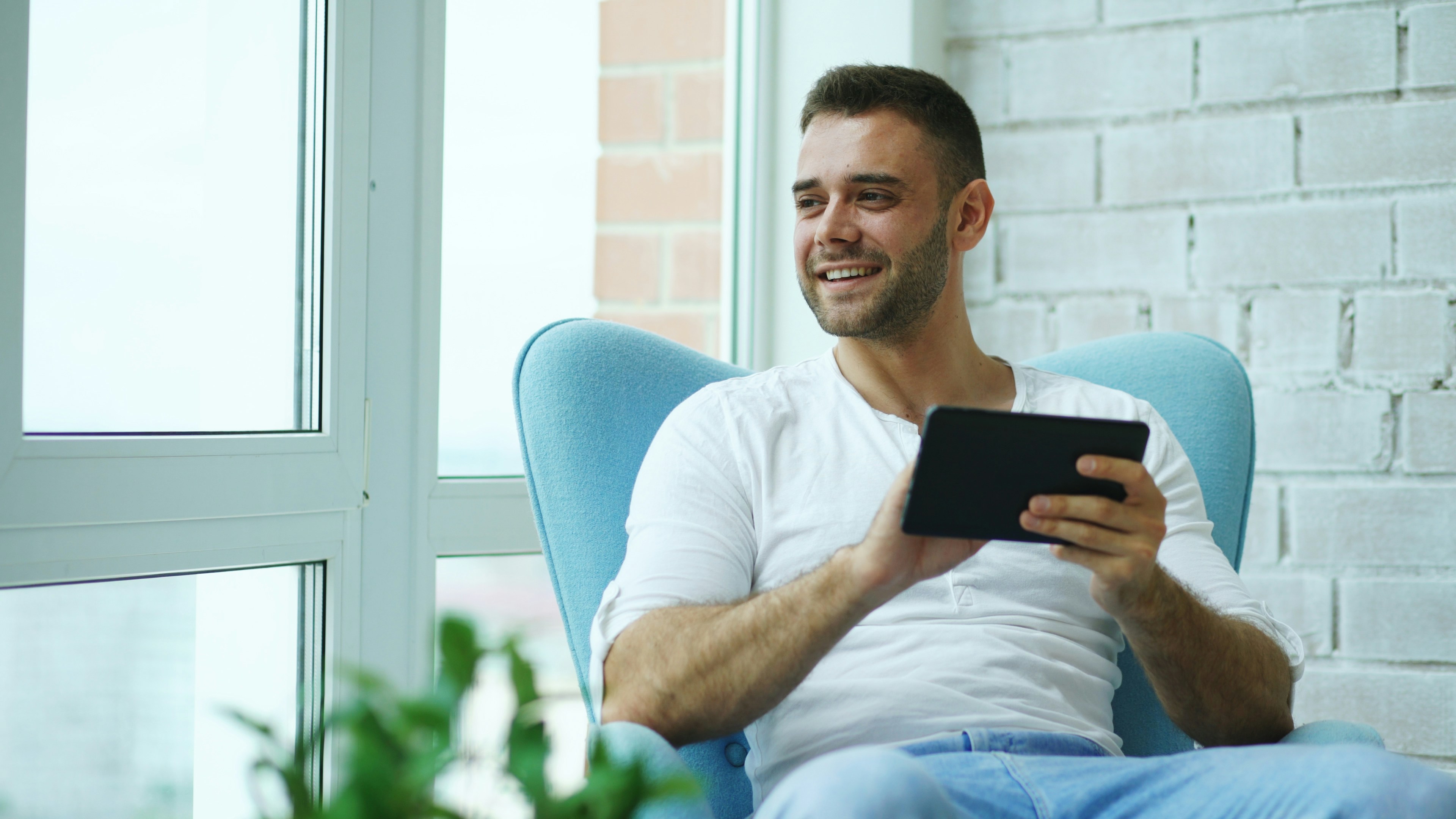 Man relaxing with tablet