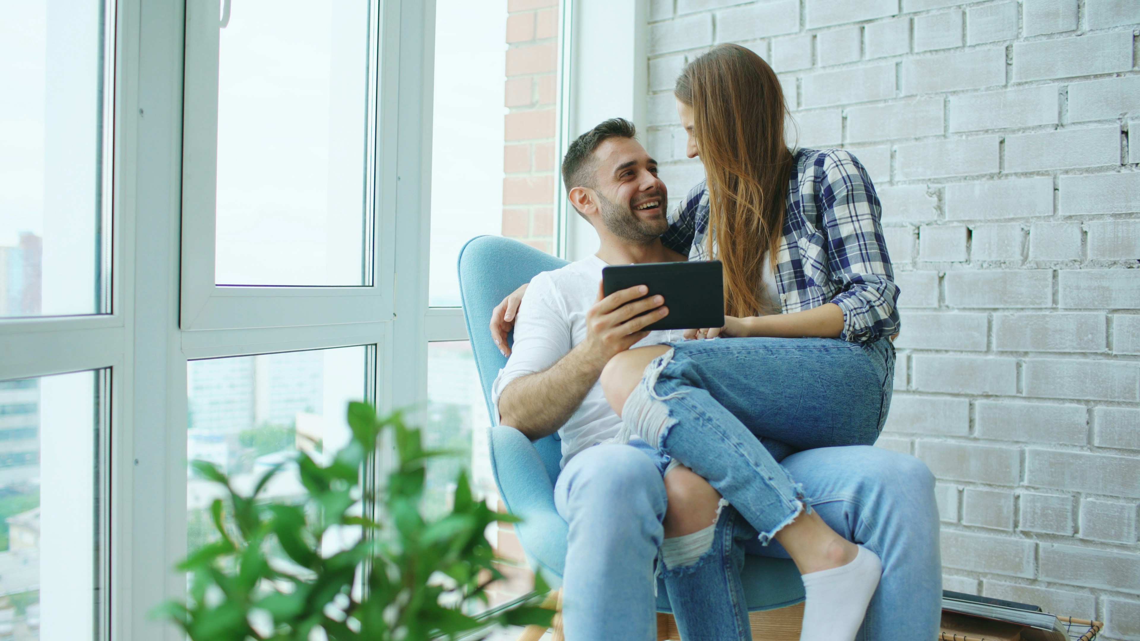 Cheerful couple on balcony