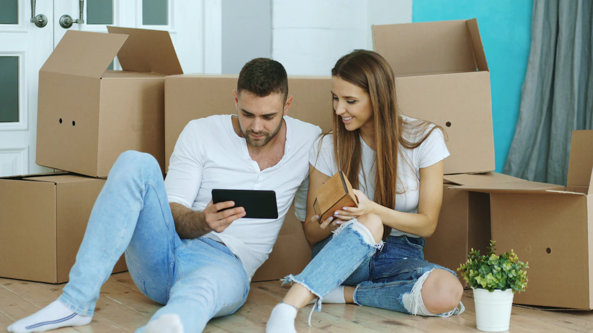 Couple planning a relocation surrounded by moving boxes in a new home