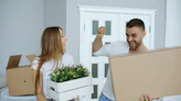 Couple happily moving into a new home