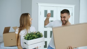 Couple happily moving into a new home