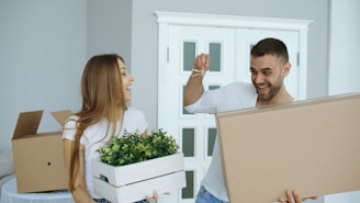 Couple happily moving into a new home