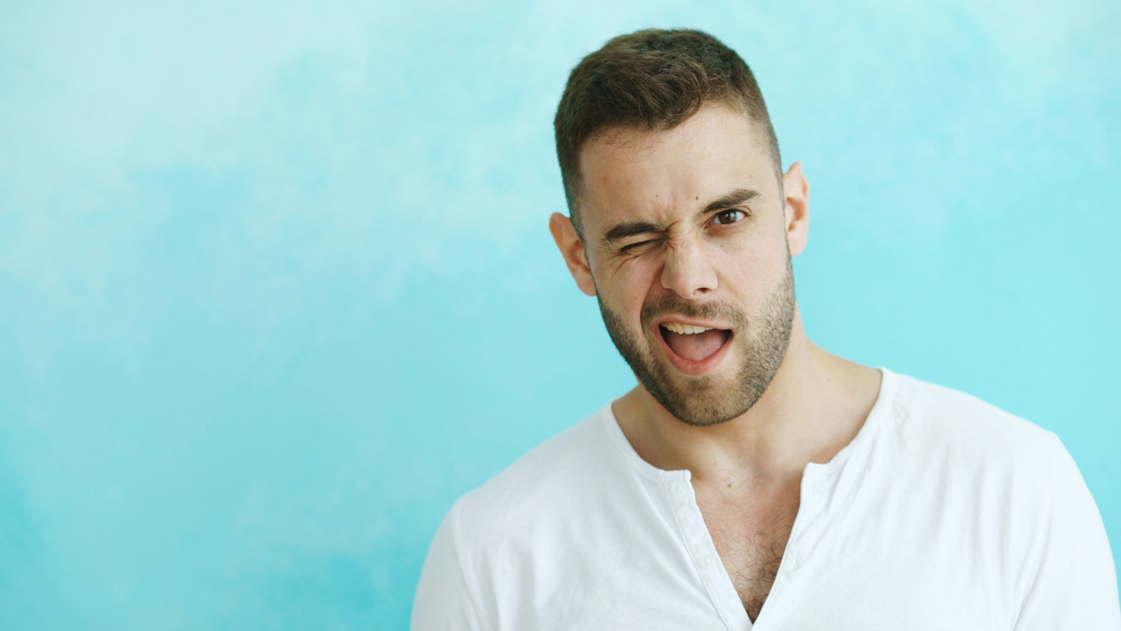 Man winking with mouth open against blue background photo – Free Funny  Image on Unsplash, image size:3000x1688
