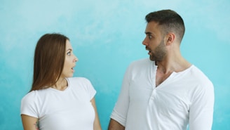 Couple looking at each other with surprise